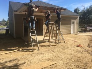 contractors replacing a roof